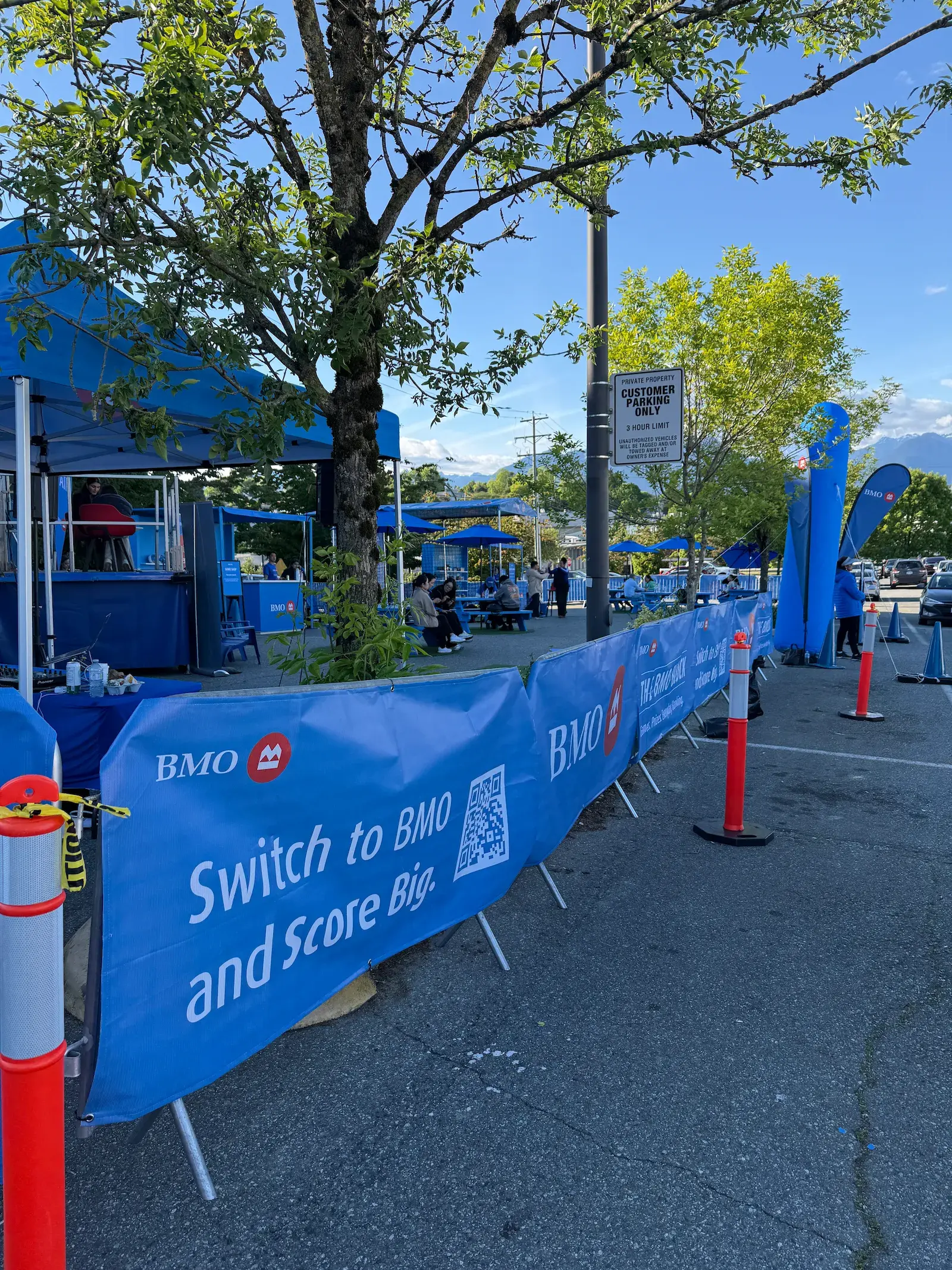 Steel barriers framing a branded outdoor activation space.